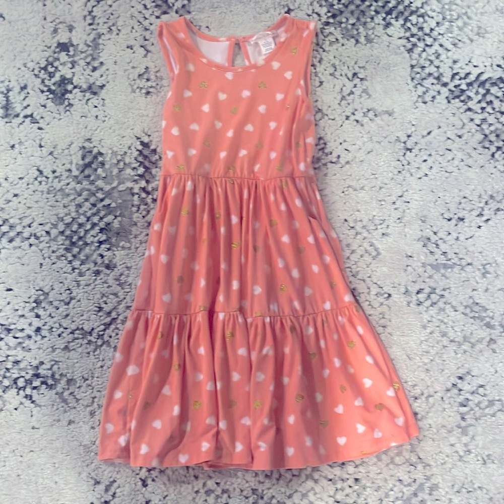 Peachy/Pink dress with white and gold hearts.